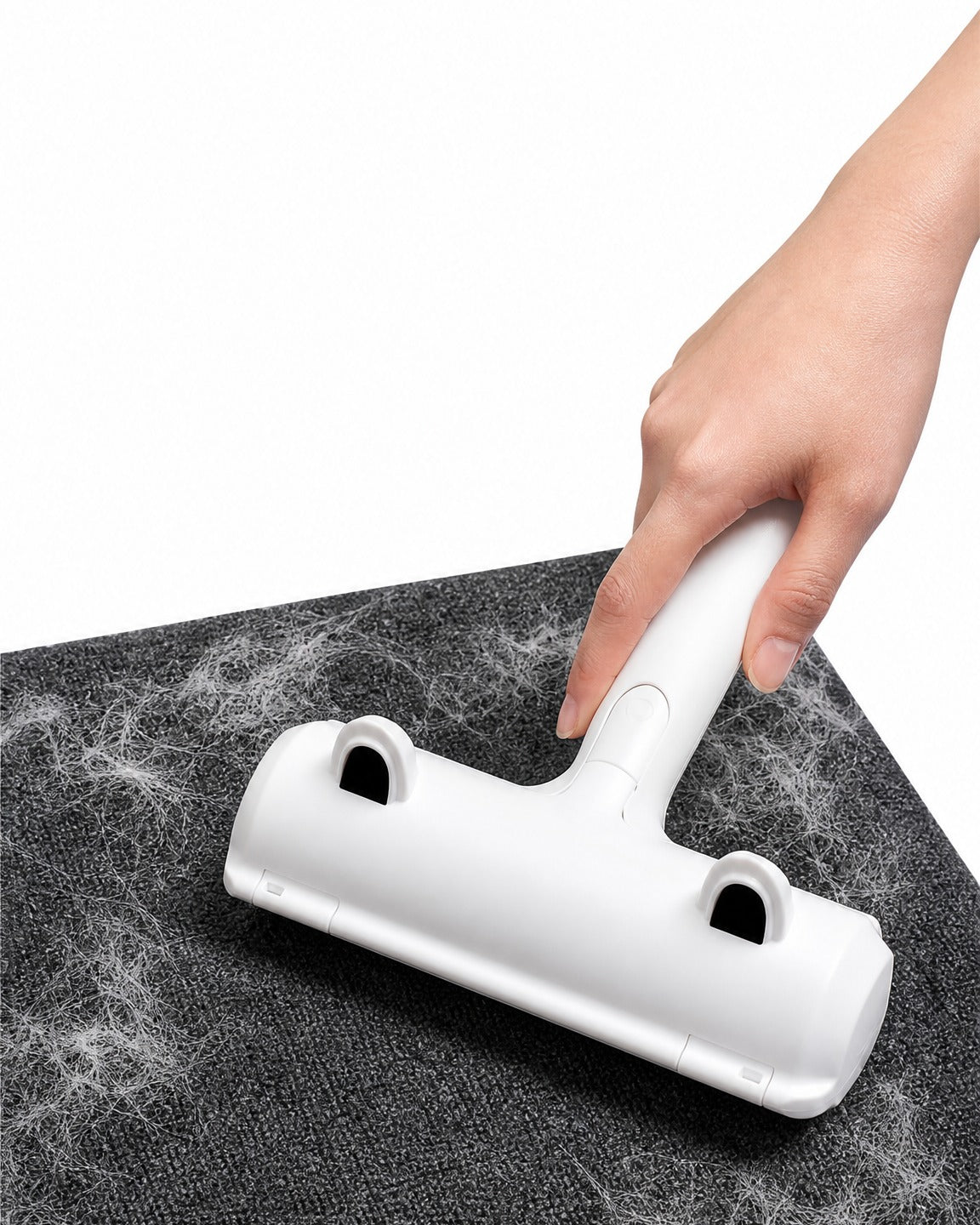 Rolling RevoFur over a gray rug to lift pet hair