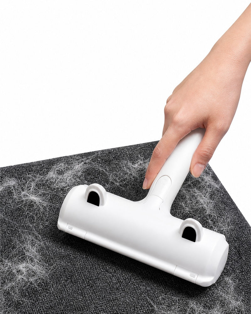 Rolling RevoFur over a gray rug to lift pet hair